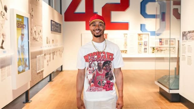 Mookie Betts smiles in museum.
